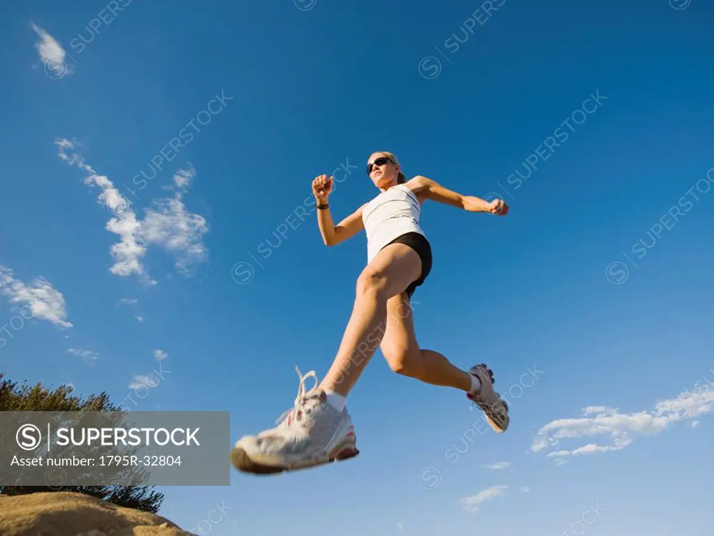 Trail runner jumping