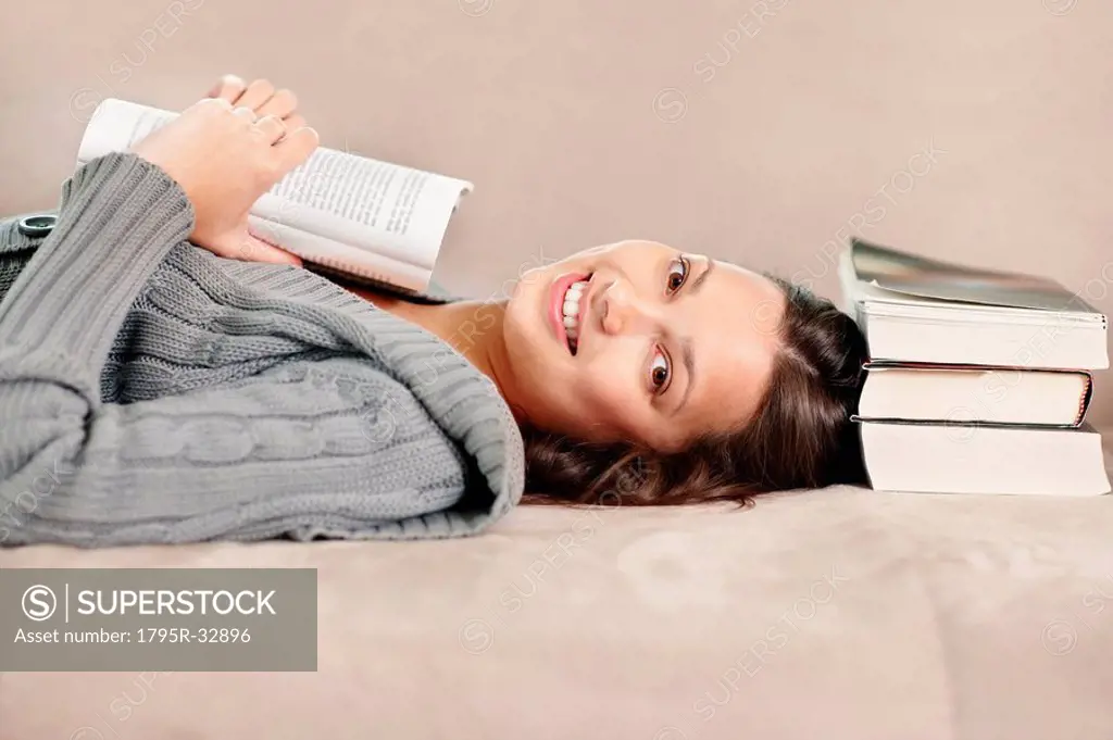 Brunette woman relaxing and reading