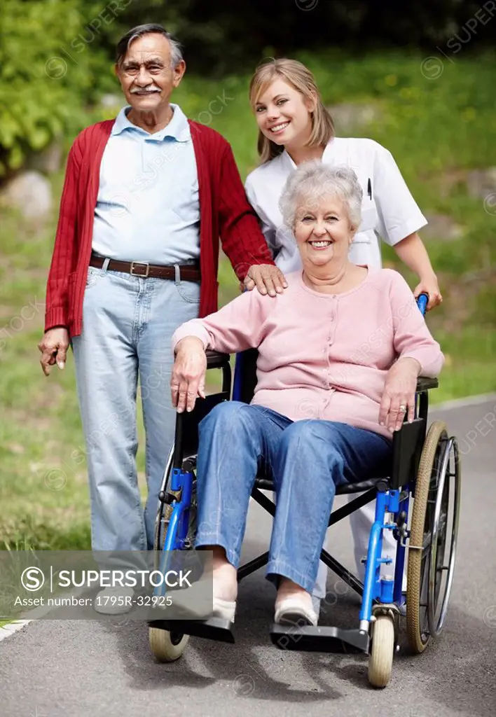 Nurse pushing senior woman in a wheelchair