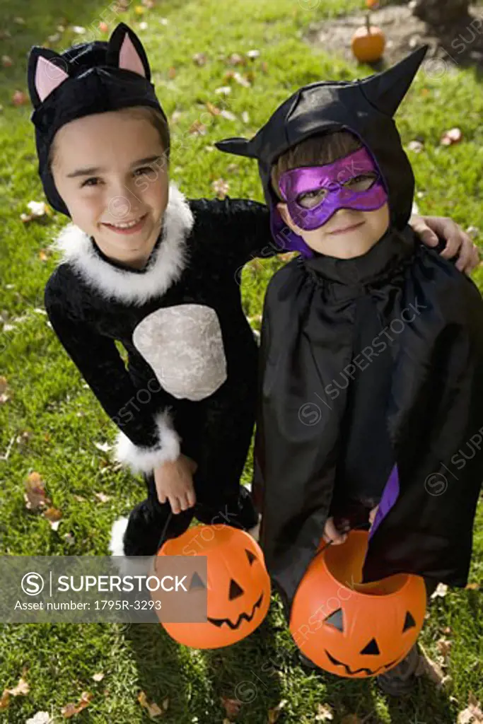 Boy and girl in Halloween costumes