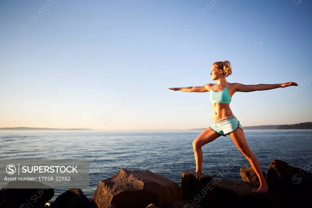 Athletic woman stretching outdoors