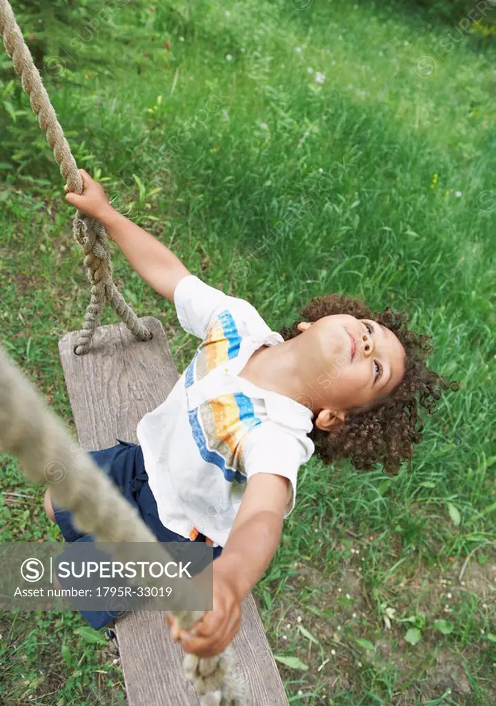 Carefree child swinging
