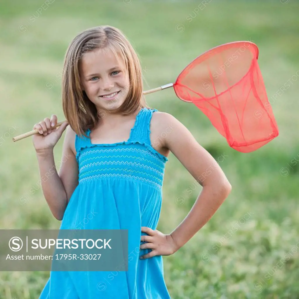 Young girl holding a butterfly net