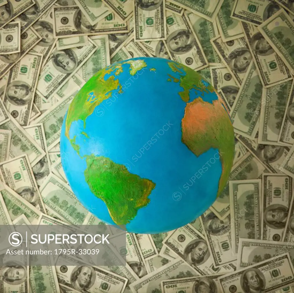 Globe on top of money