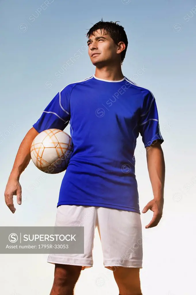 Soccer player holding ball