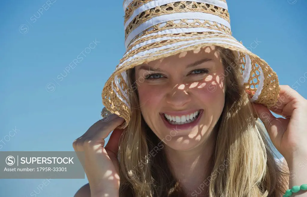 Pretty woman wearing straw hat