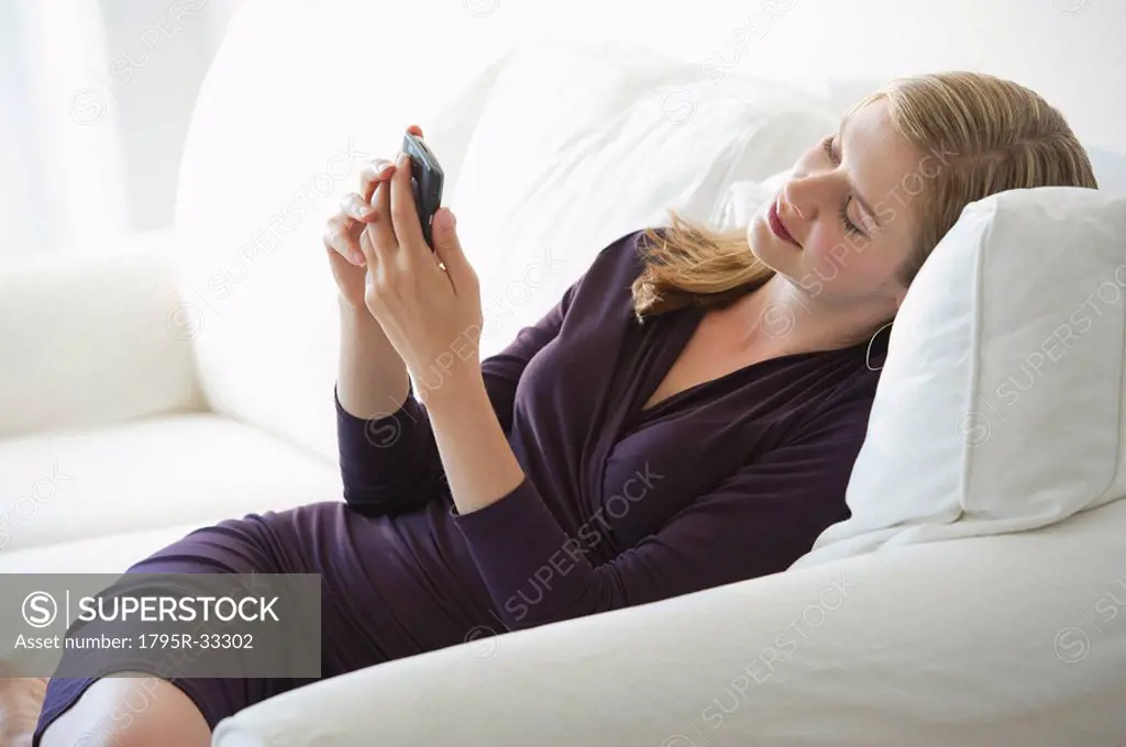 Sophisticated woman relaxing on couch