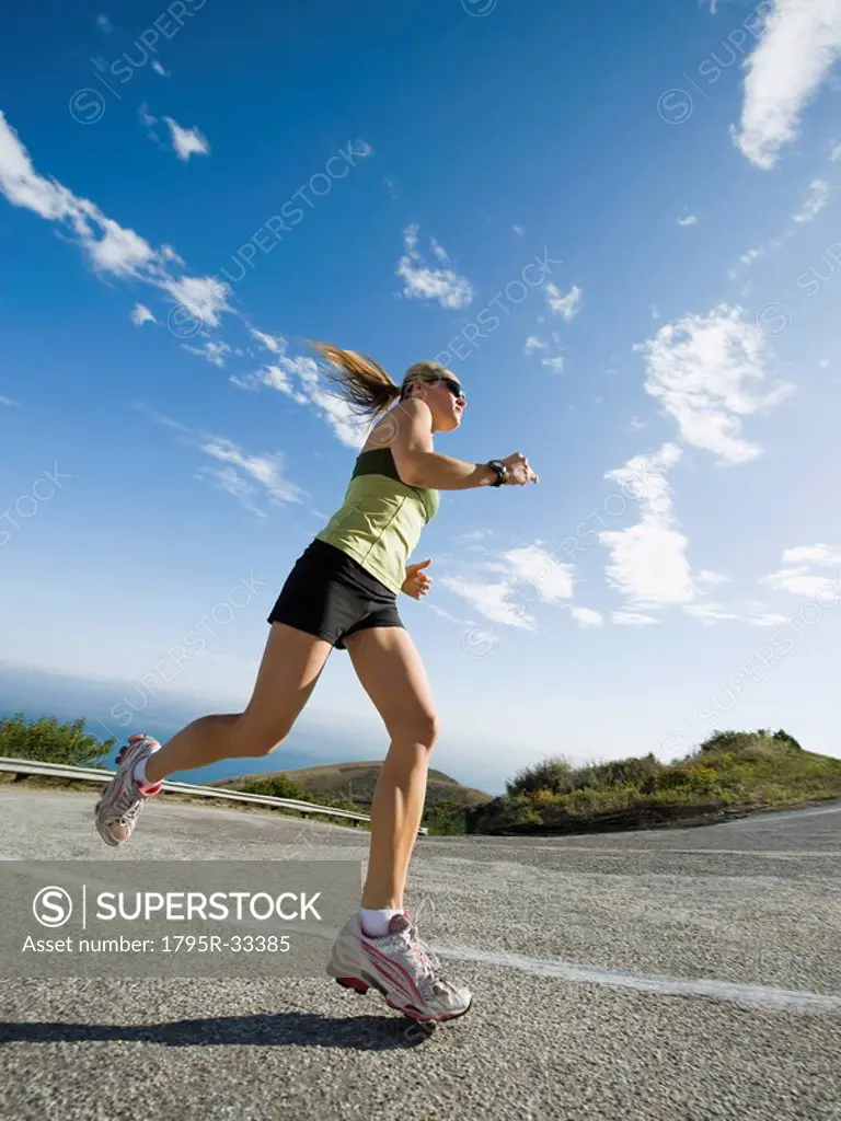 Woman running on a road in Malibu