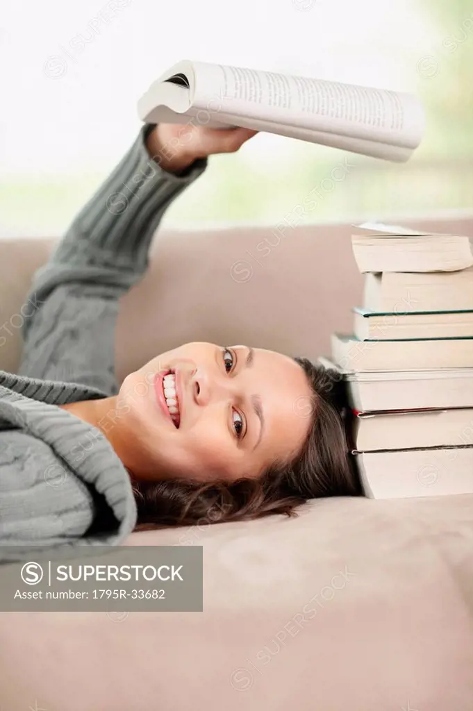 Brunette woman relaxing and reading