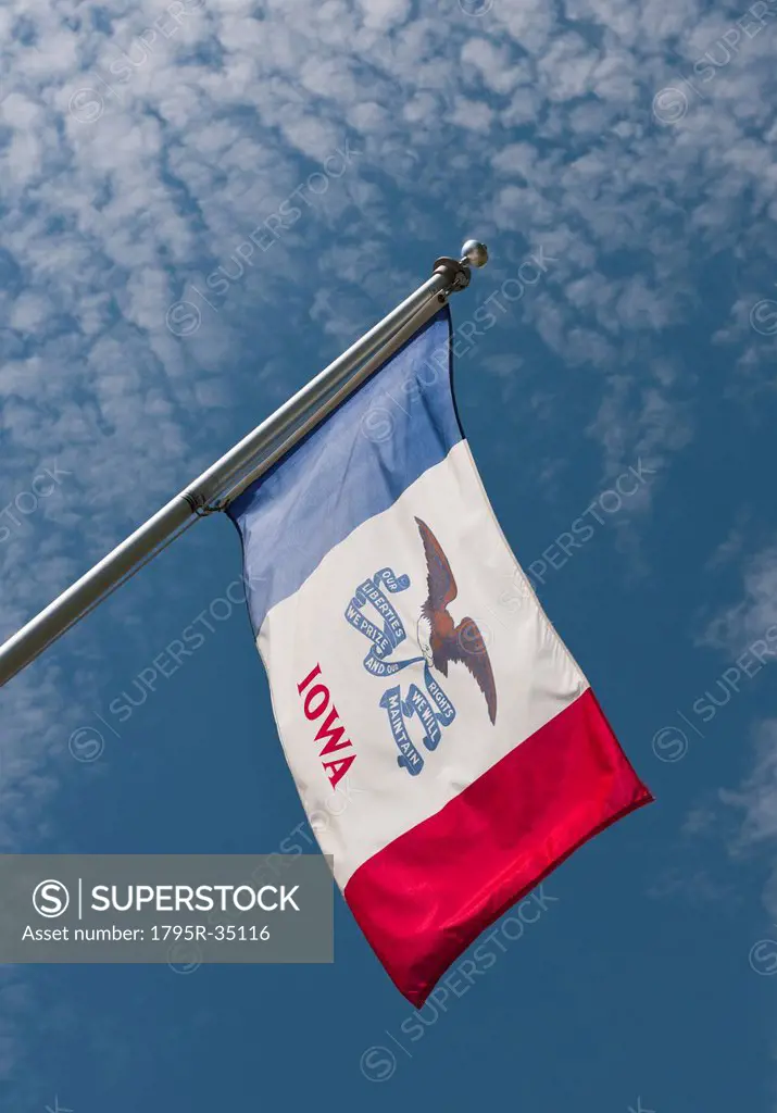 USA, Iowa State flag against sky
