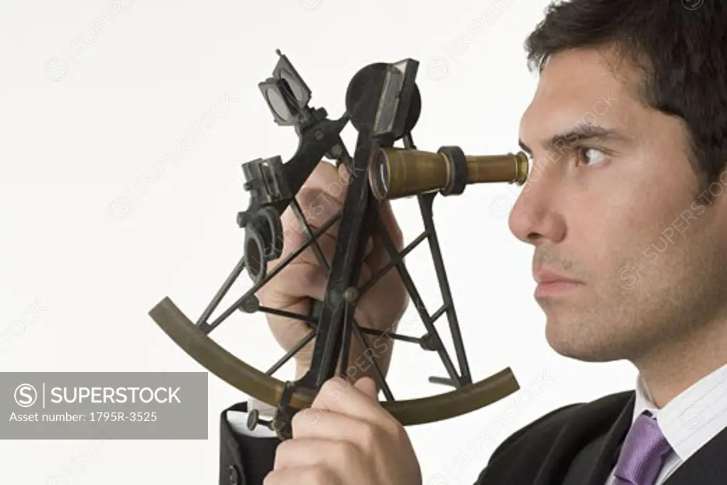 Man holding a sextant