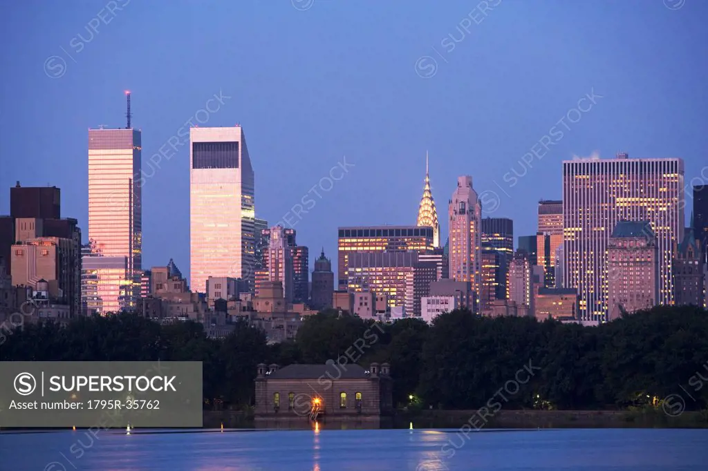 USA, New York State, New York City, Skyline with Bloomberg Building and Chrysler Building at dusk, view from Central Park