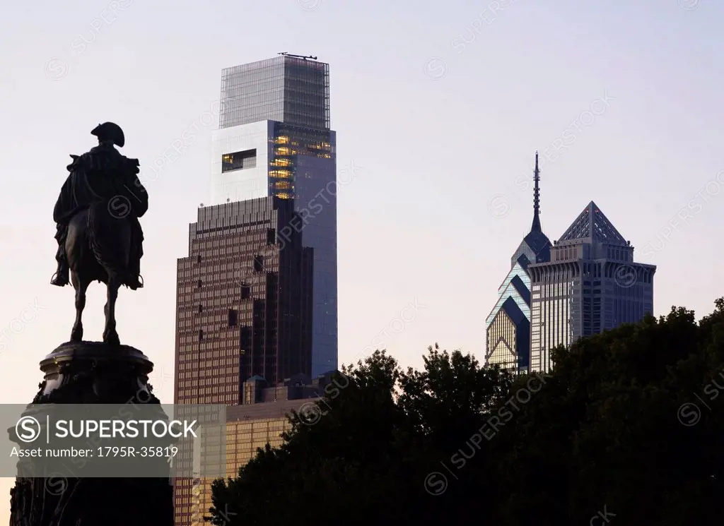 USA, Pennsylvania, Philadelphia, Silhouette of statue, Skyscrapers in background
