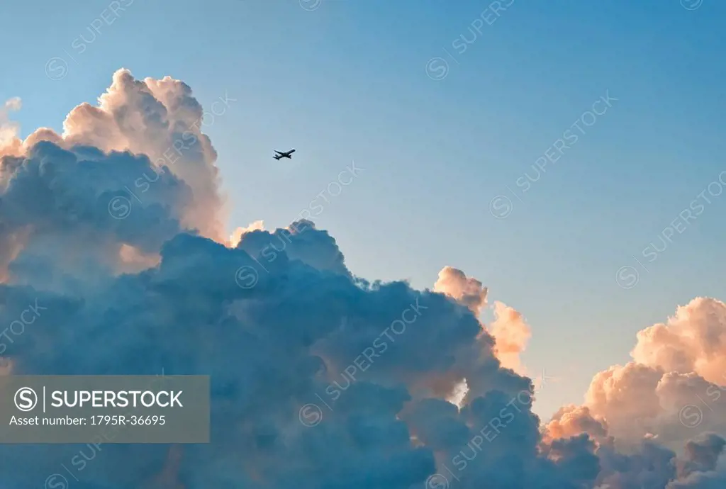Clouds and airplane