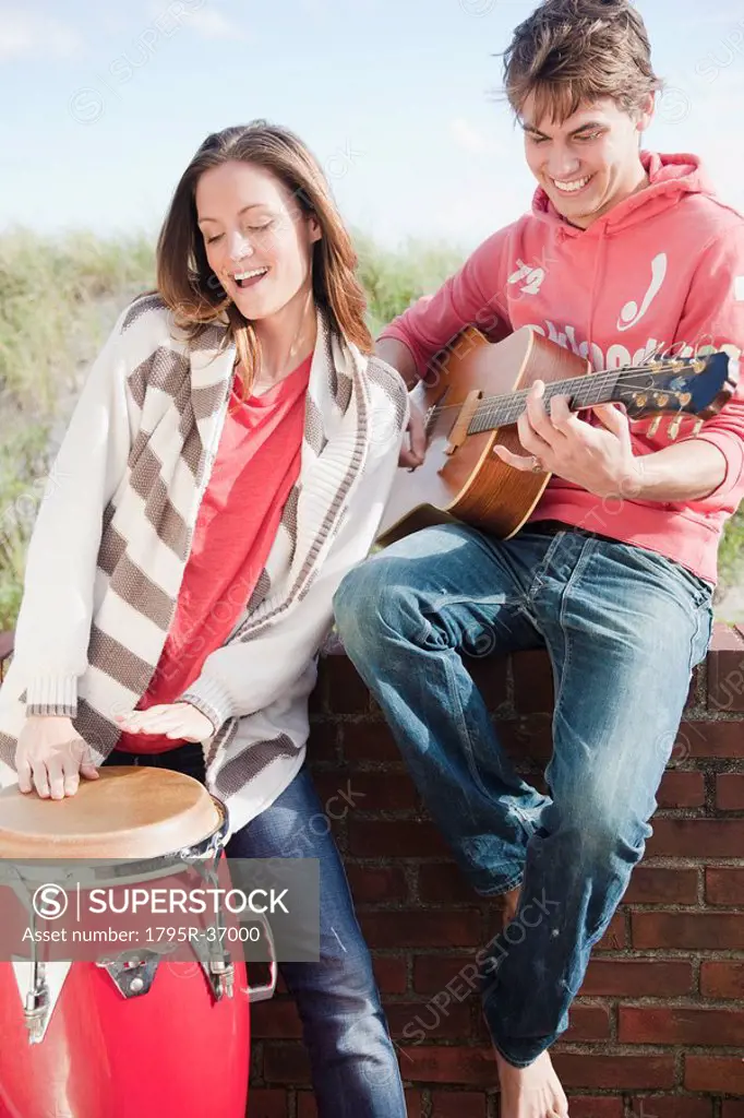 Couple playing instruments