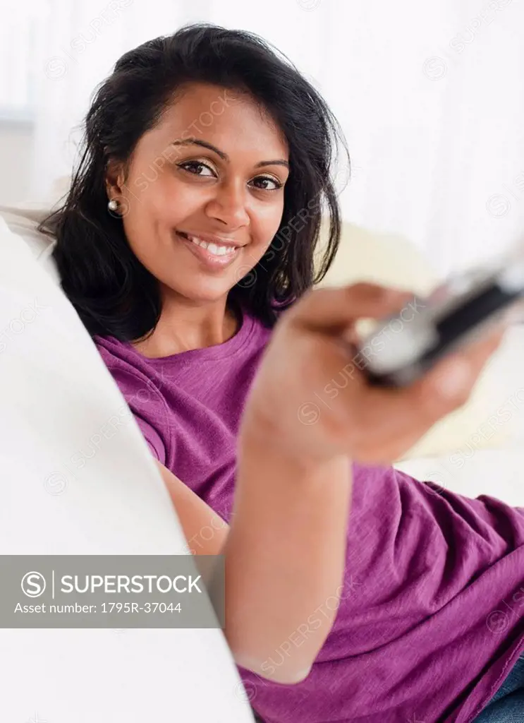Woman holding remote control