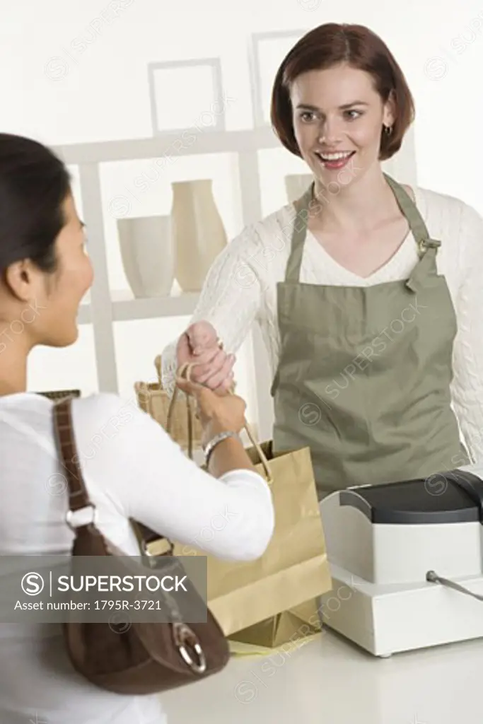 Shopkeeper with customer