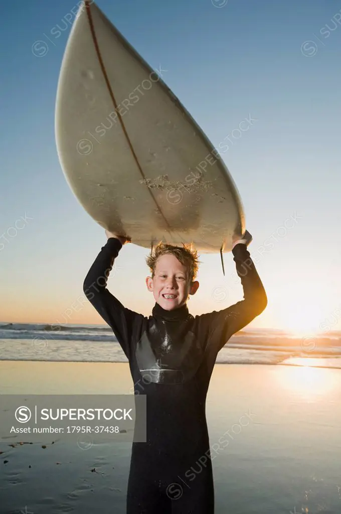 Child holding surfboard
