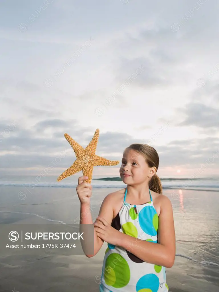 Girl holding starfish