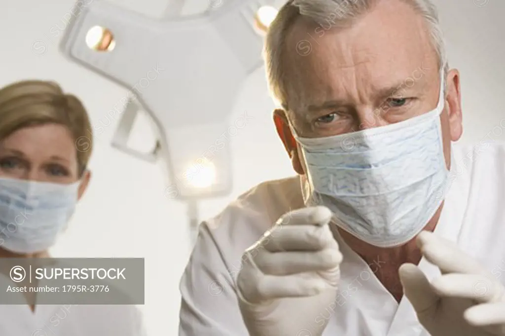 Portrait of dentist with hygienist