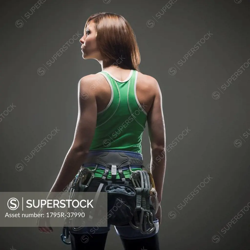 Back view of woman with climbing gear