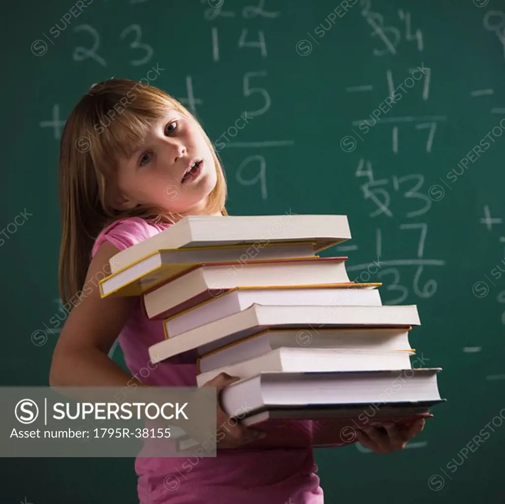 Young student holding books