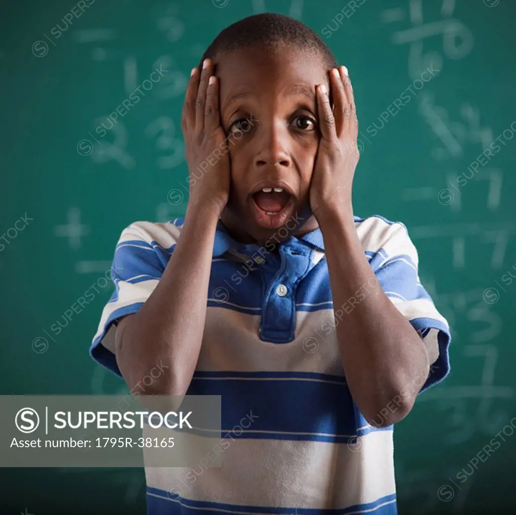 Student in front of chalkboard