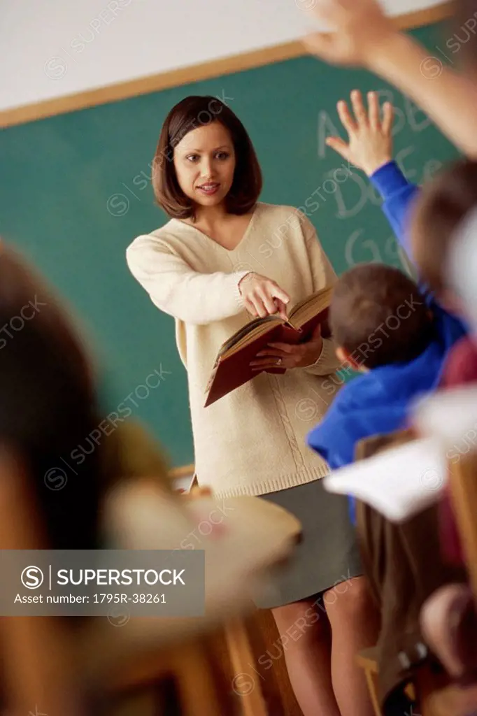 Teacher calling on student in classroom