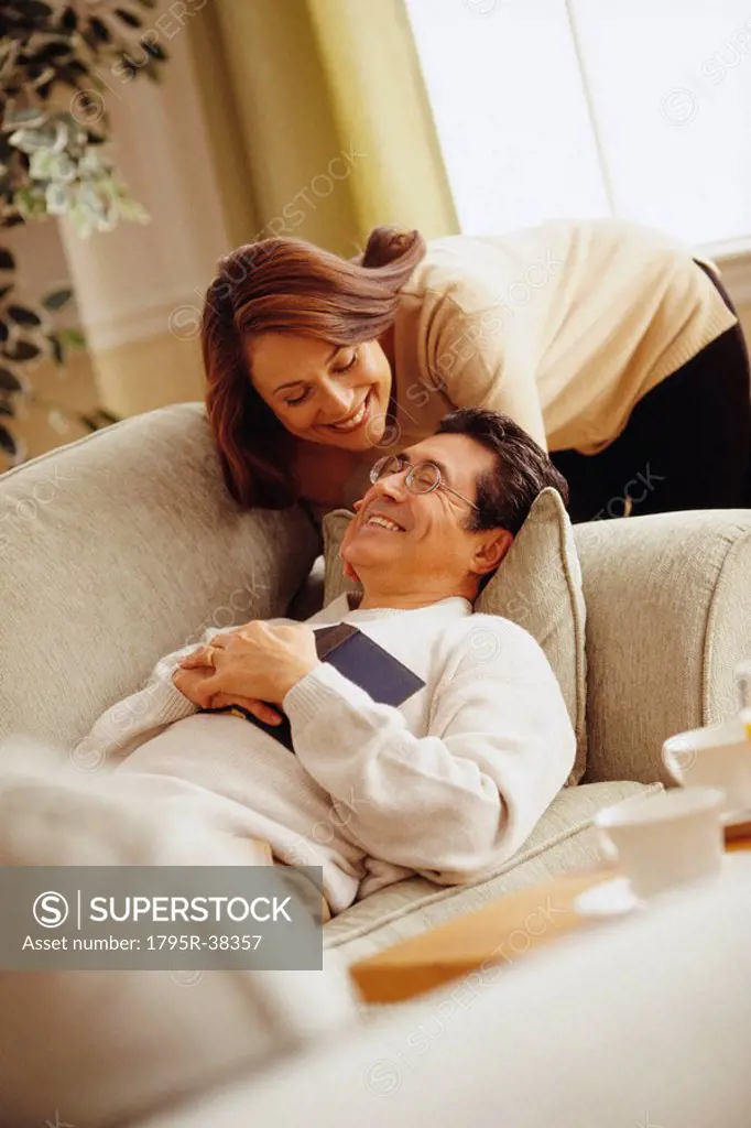 Happy couple in living room