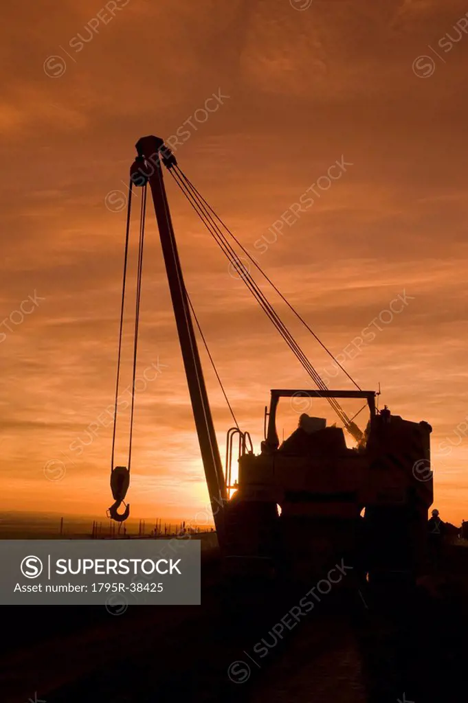 Heavy equipment at sunset