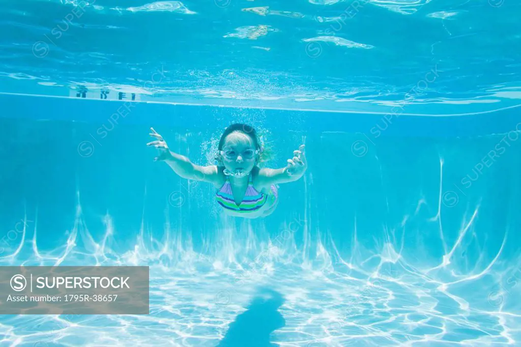 A young girl in a swimming pool
