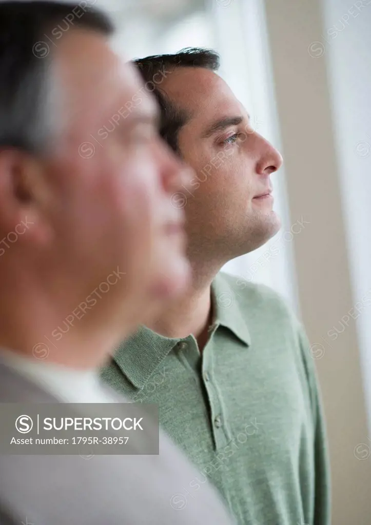 USA, New Jersey, Jersey City, Pensive man with father in foreground