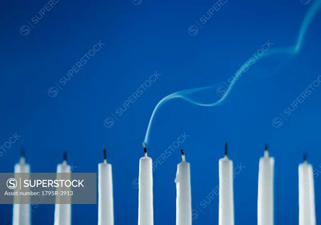 Extinguished candles in a menorah