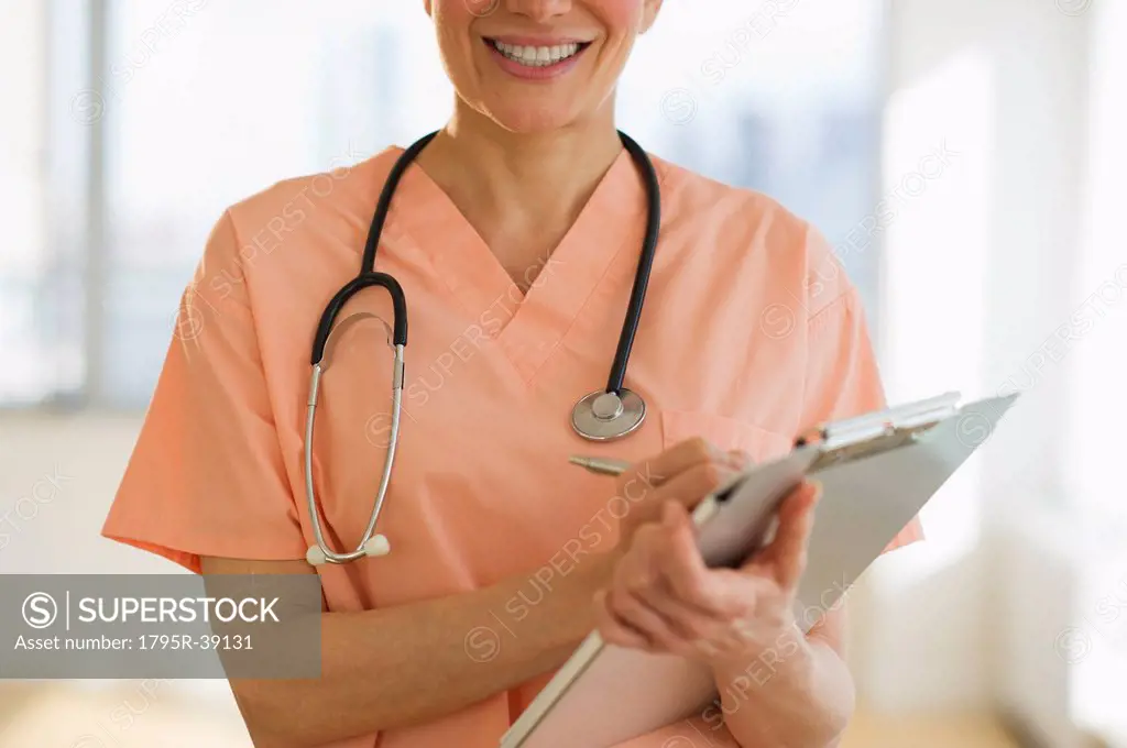 USA, New Jersey, Jersey City, Female doctor writing medical report