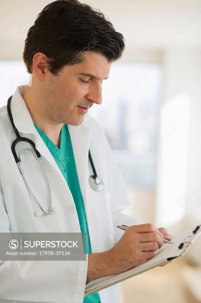 USA, New Jersey, Jersey City, Male doctor writing medical report