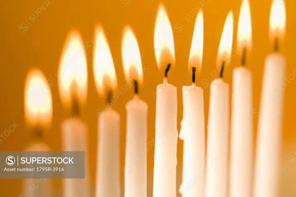 Candles burning in a menorah