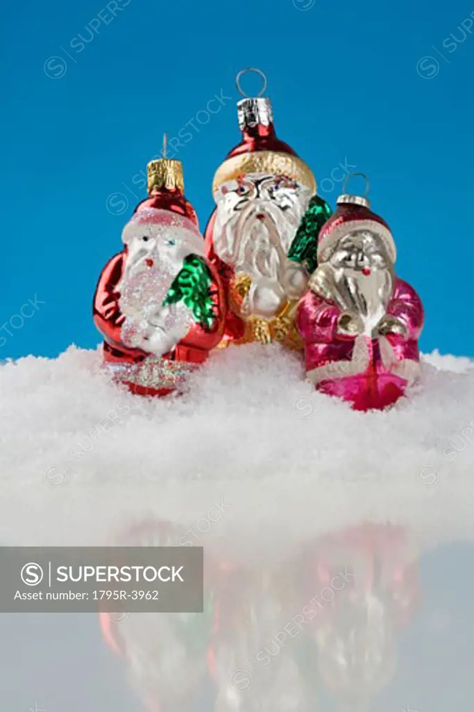 Three Santa Claus Christmas ornanaments