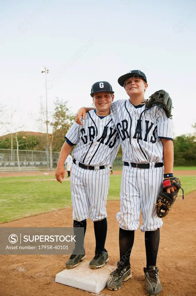 USA, California, Ladera Ranch, two boys 10_11 in baseball uniforms
