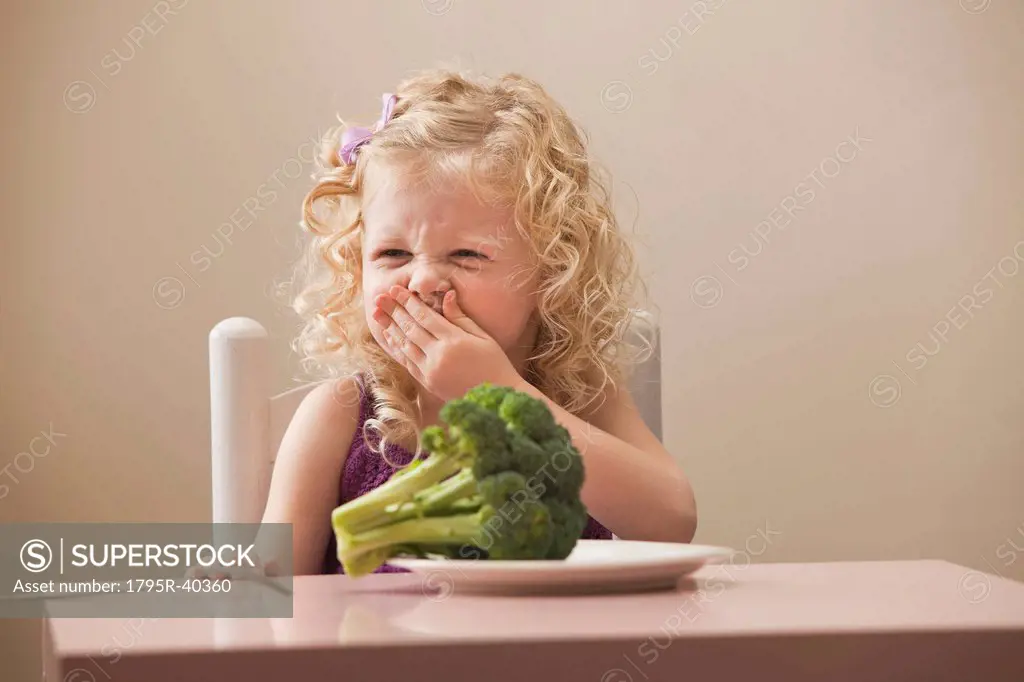 USA, Utah, Lehi, girl 2_3 disgusted with broccoli