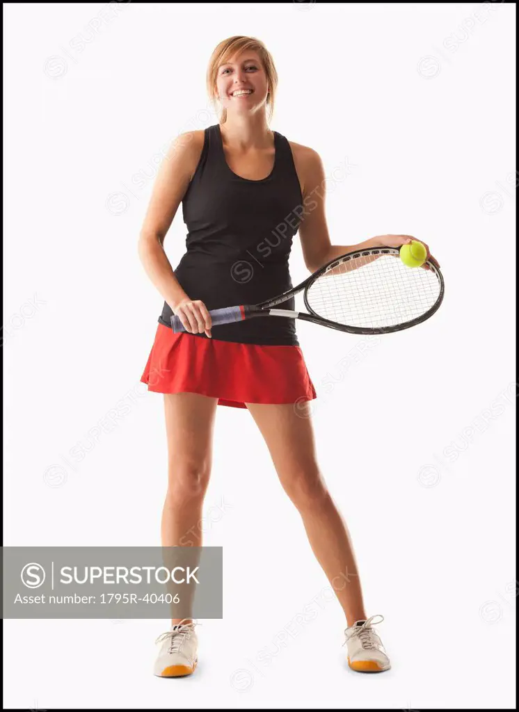 Young woman holding tennis racket