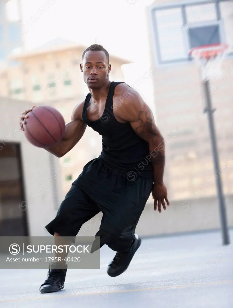 USA, Utah, Salt Lake City, young man playing basketball