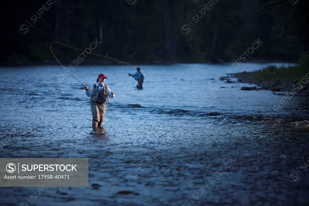 Canada, British Columbia, Fernie, Women fly fishing in river