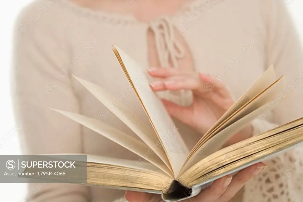 Woman paging through a book