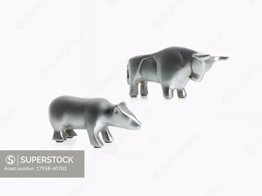 Studio shot of silver figurines of bull and bear