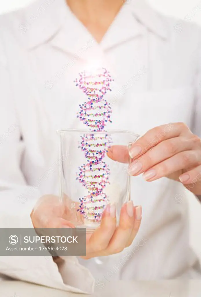 Hands holding DNA in beaker