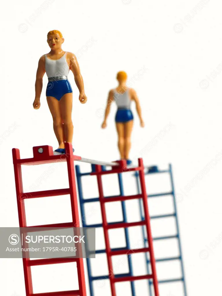 Studio shot of figurines on ladders