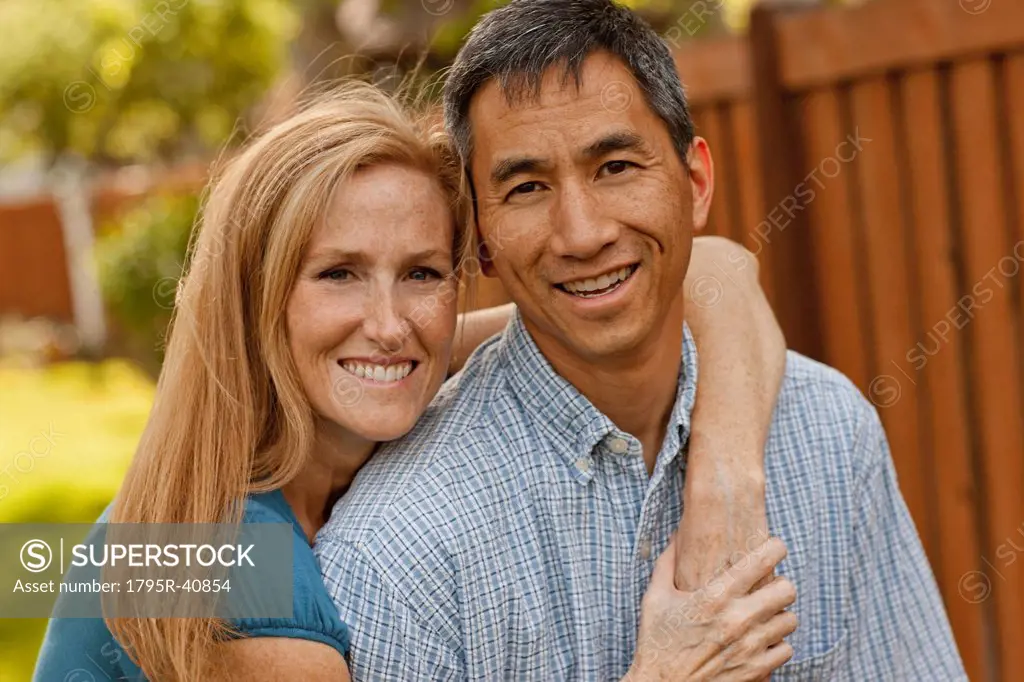 USA, Utah, Provo, Portrait of smiling mature couple in garden