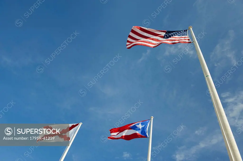 Puerto Rico, Old San Juan, low angle view of flags under blue sky