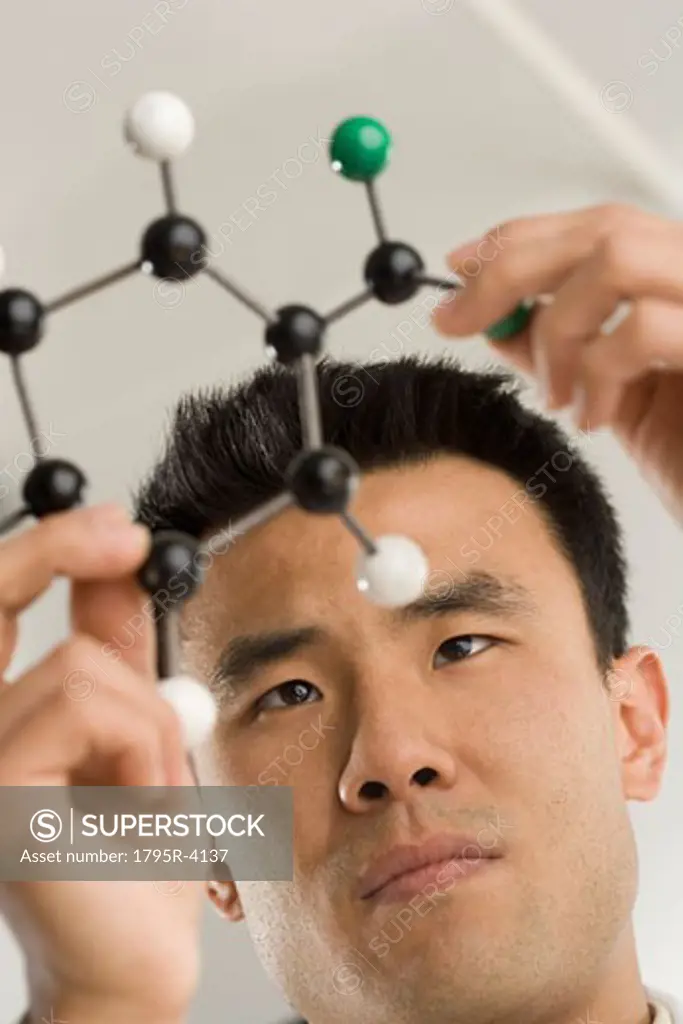 Scientist examining molecular structure