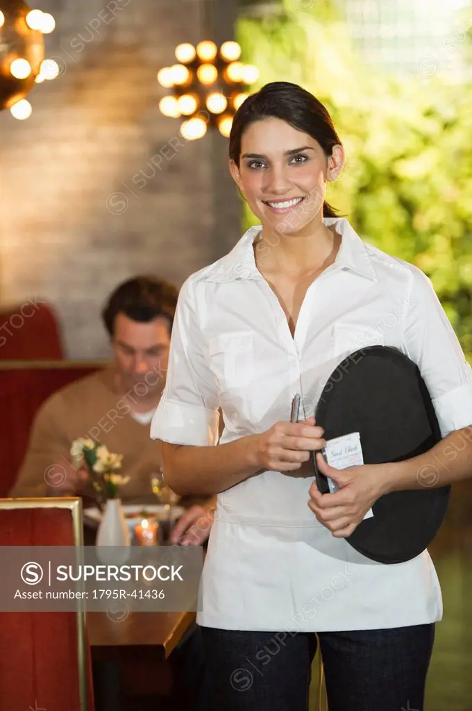Smiling waitress in restaurant